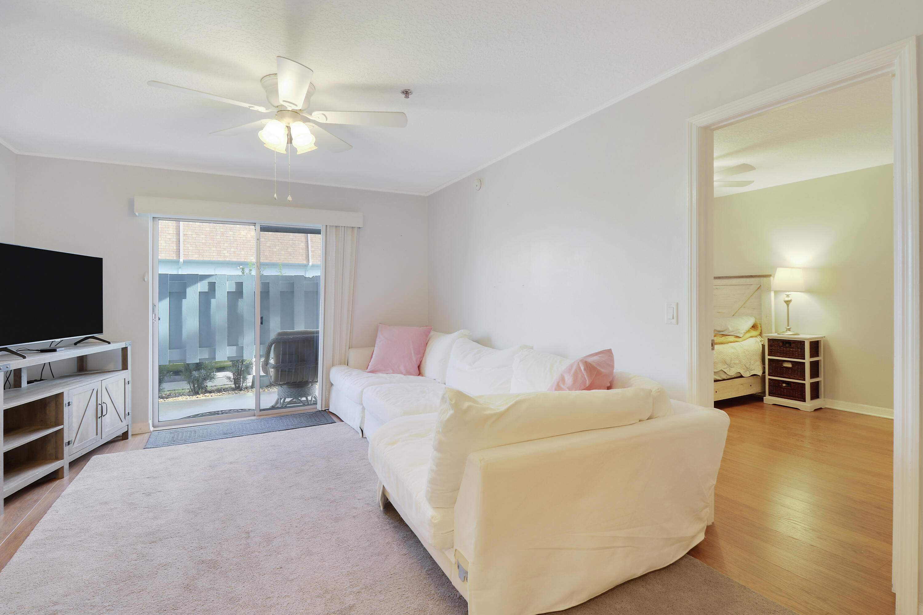 950 South Kanner Highway, Unit E2 Stuart, FL 34994 - Photo 9 of 37 Living Room with access to outdoor patio