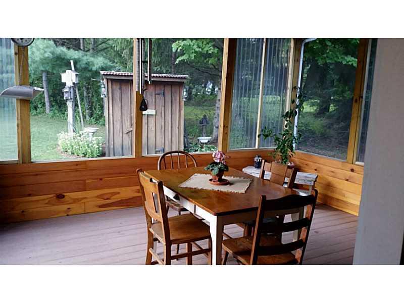 279 Alwine Road Boswell, PA 15531 - Photo 5 of 25 Sunroom. Screened back porch also has clear panels for spring and fall use.