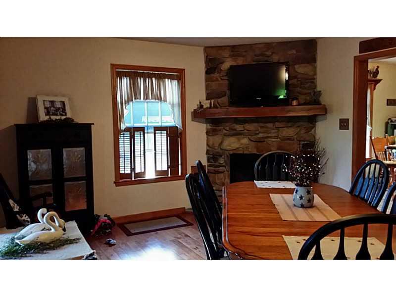 279 Alwine Road Boswell, PA 15531 - Photo 9 of 25 Dining Room. Large dining room, oak floors, stone gas fireplace. Perfect for entertaining!