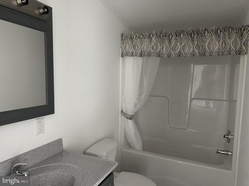 65 Ash Road Hamburg, PA 19526 - Photo 16 of 18 a bathroom with a shower a toilet and sink