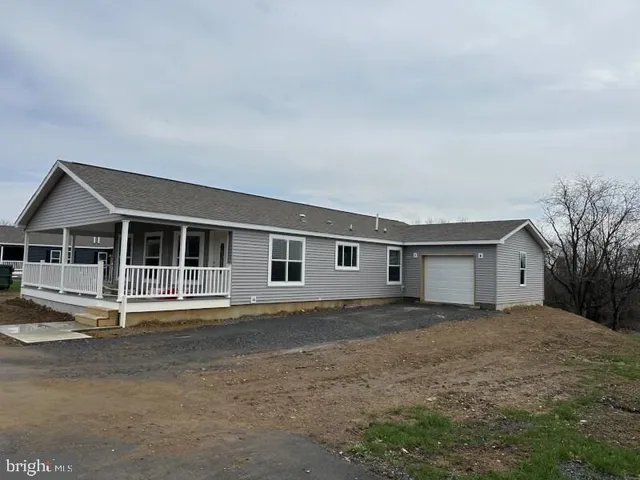a house with trees in the background