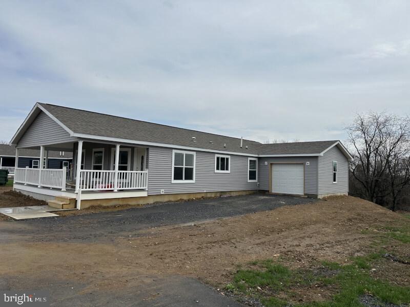 65 Ash Road Hamburg, PA 19526 - Photo 3 of 18 a house with trees in the background