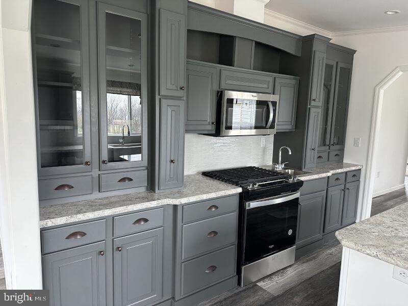65 Ash Road Hamburg, PA 19526 - Photo 5 of 18 a kitchen with granite countertop cabinets stainless steel appliances and a counter space