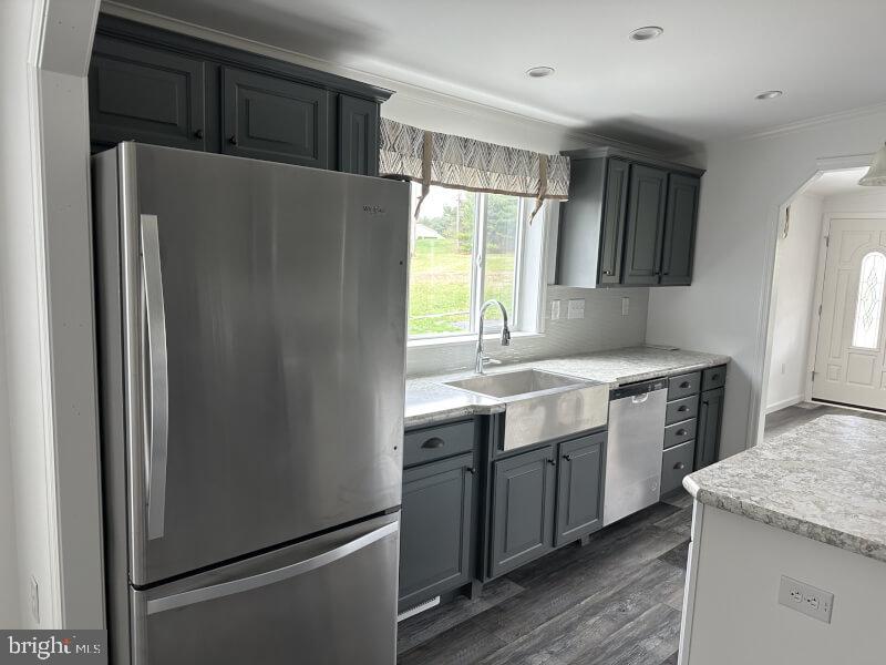 65 Ash Road Hamburg, PA 19526 - Photo 6 of 18 a kitchen with stainless steel appliances granite countertop a refrigerator sink and stove