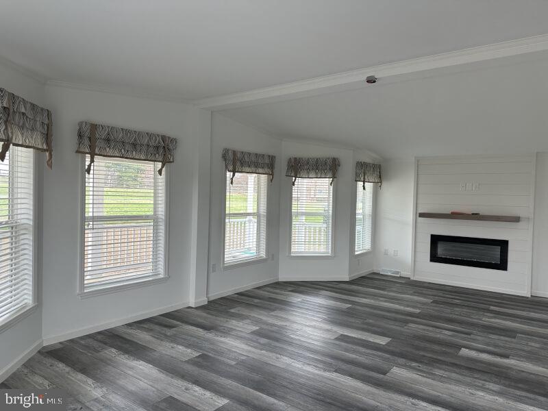 65 Ash Road Hamburg, PA 19526 - Photo 8 of 18 a view of an empty room with wooden floor and a window