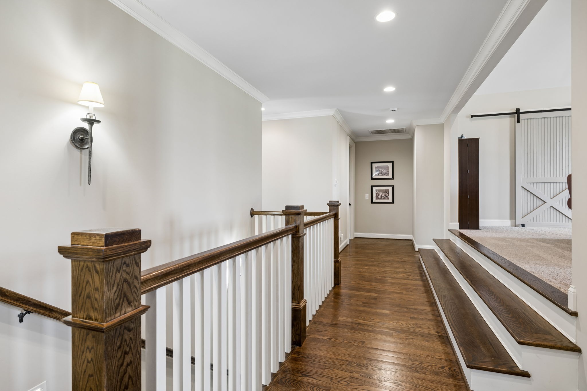 6033 Native Pony Trail College Grove, TN 37046 - Photo 54 of 87 a view of a hallway with wooden floor and staircase