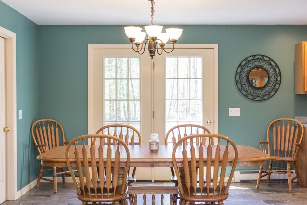 49 Duval Road Sutton, MA 01590 - Photo 15 of 27 a view of a balcony with furniture and wooden floor