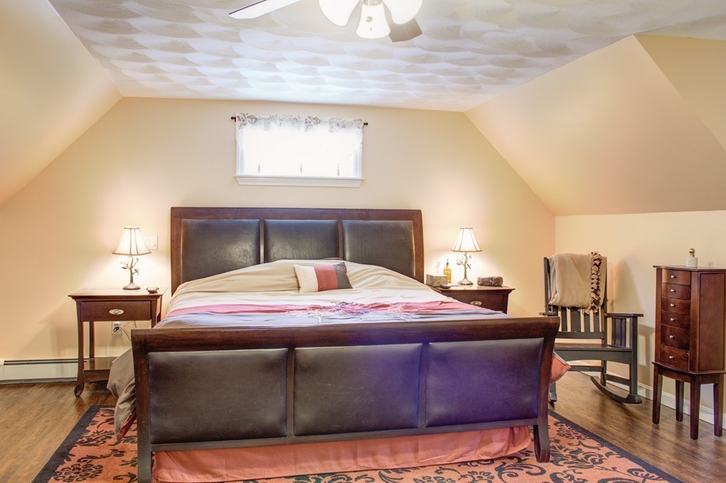 49 Duval Road Sutton, MA 01590 - Photo 23 of 27 a bedroom with a bed window and table chair