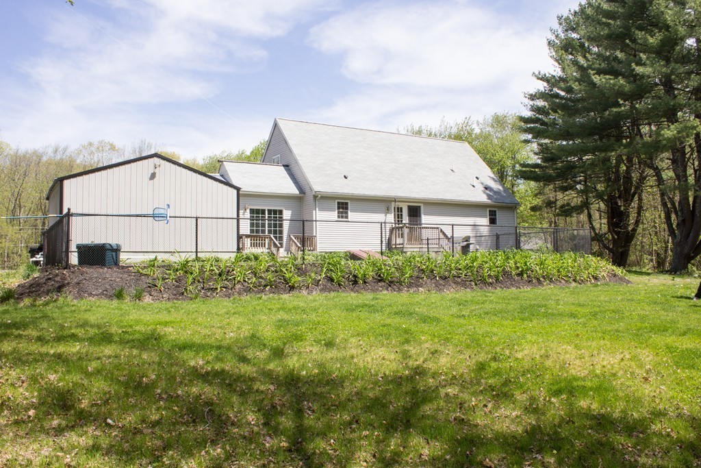 49 Duval Road Sutton, MA 01590 - Photo 4 of 27 a view of a back yard of the house