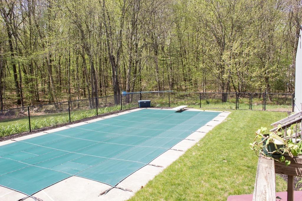 49 Duval Road Sutton, MA 01590 - Photo 6 of 27 a swimming pool with outdoor seating and garden