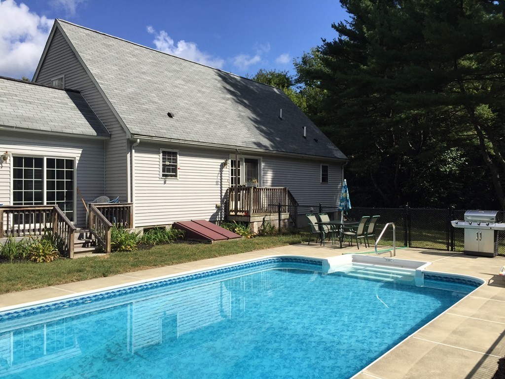 49 Duval Road Sutton, MA 01590 - Photo 8 of 27 a view of a house with backyard and sitting area