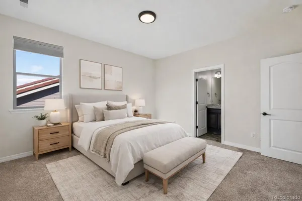 a bedroom with bed and window