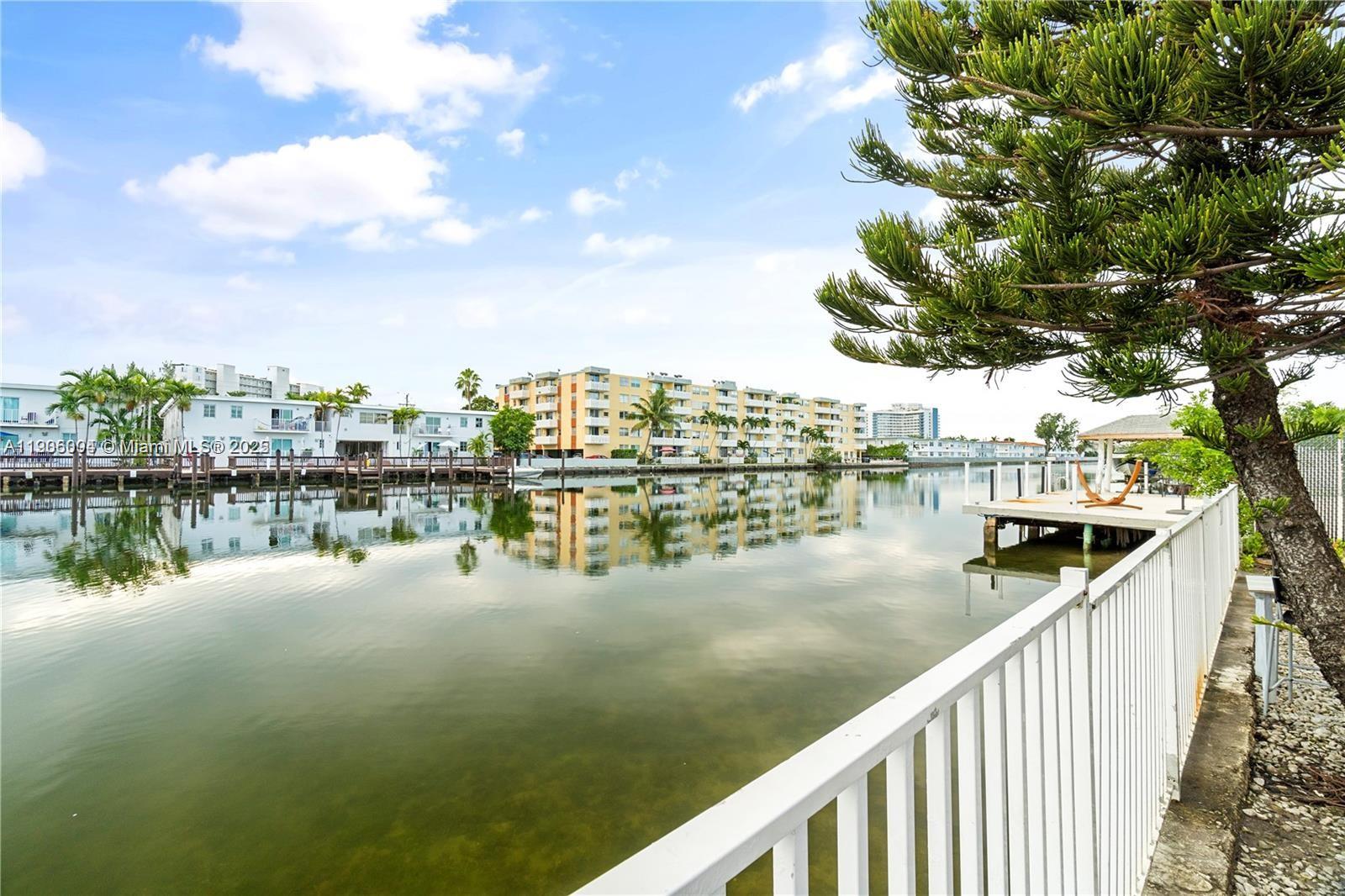 7975 Crespi Boulevard, Unit 1 Miami Beach, FL 33141 - Photo 3 of 21 a view of a lake from a balcony