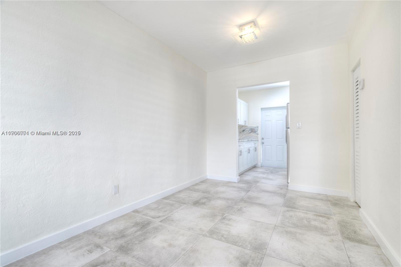 7975 Crespi Boulevard, Unit 1 Miami Beach, FL 33141 - Photo 5 of 21 a view of an empty room