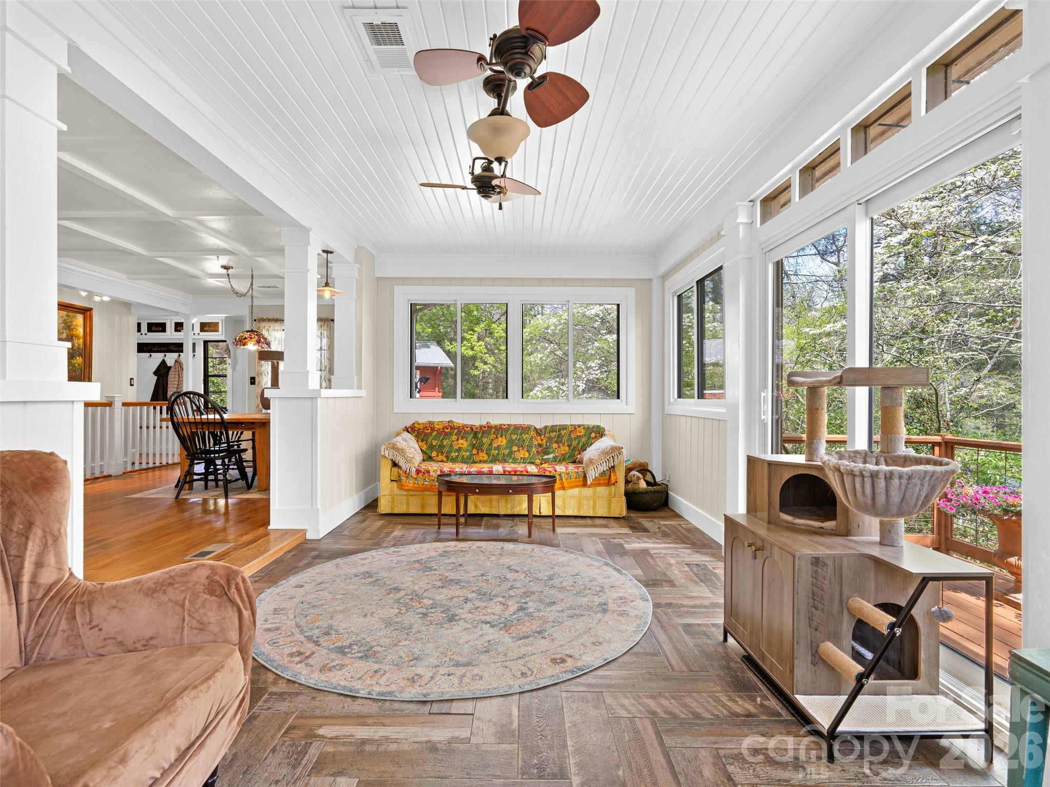 686 New Haw Creek Road Asheville, NC 28805 - Photo 12 of 47 a living room filled with furniture and a large window