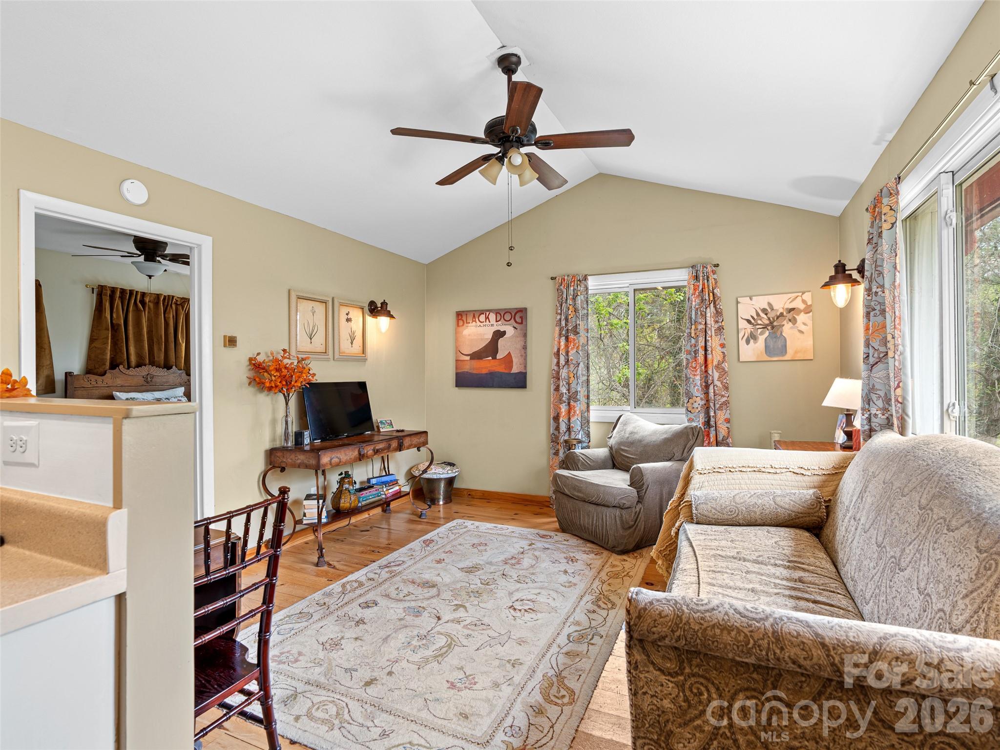 686 New Haw Creek Road Asheville, NC 28805 - Photo 40 of 47 a living room with furniture and a flat screen tv