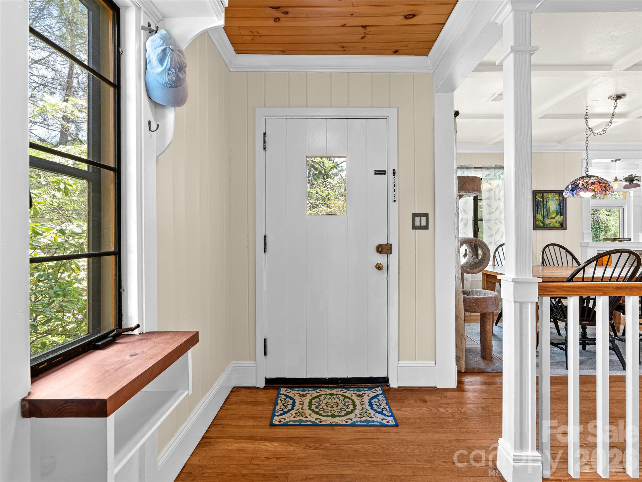 686 New Haw Creek Road Asheville, NC 28805 - Photo 4 of 47 a view of an entryway with wooden floor and windows