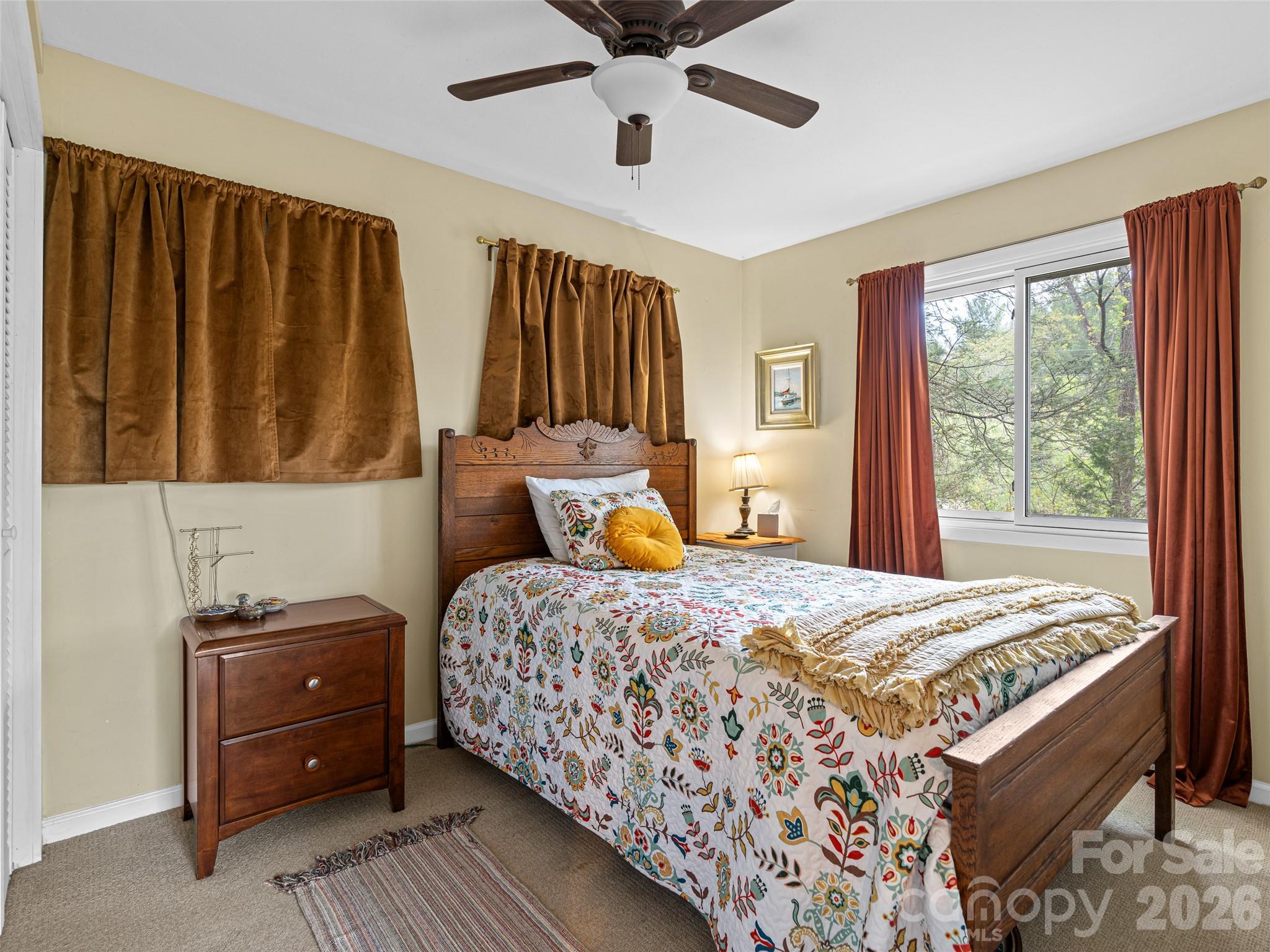 686 New Haw Creek Road Asheville, NC 28805 - Photo 44 of 47 a bedroom with a bed and a window