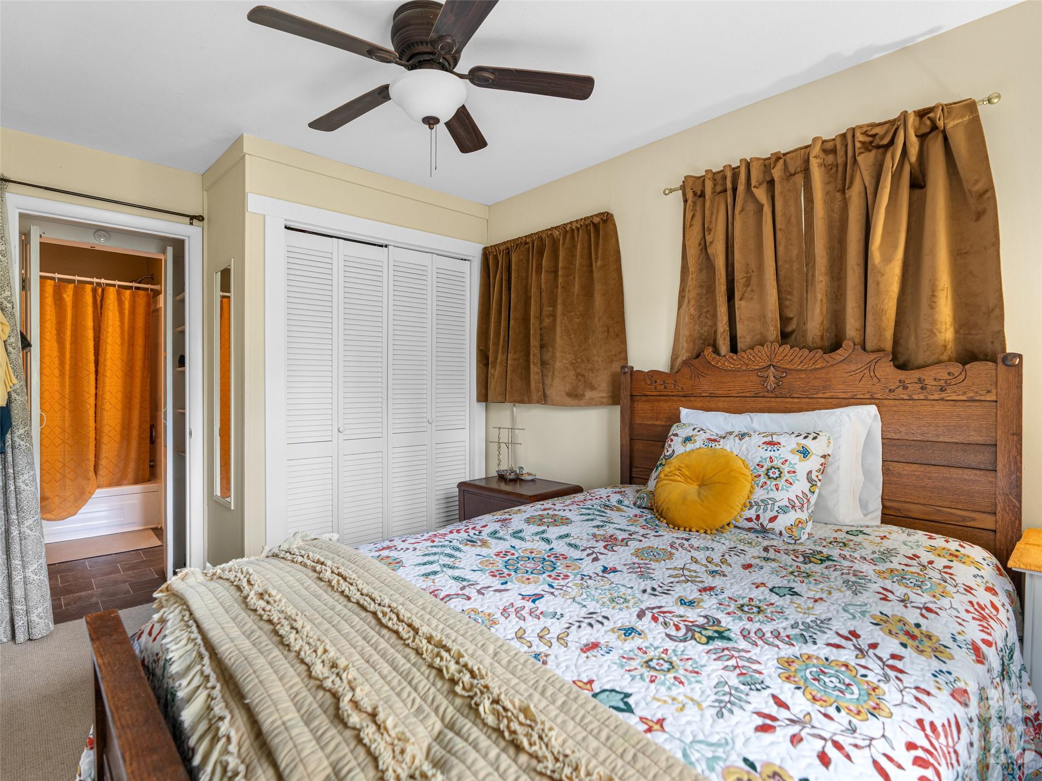 686 New Haw Creek Road Asheville, NC 28805 - Photo 45 of 47 a bedroom with a bed and wooden floor