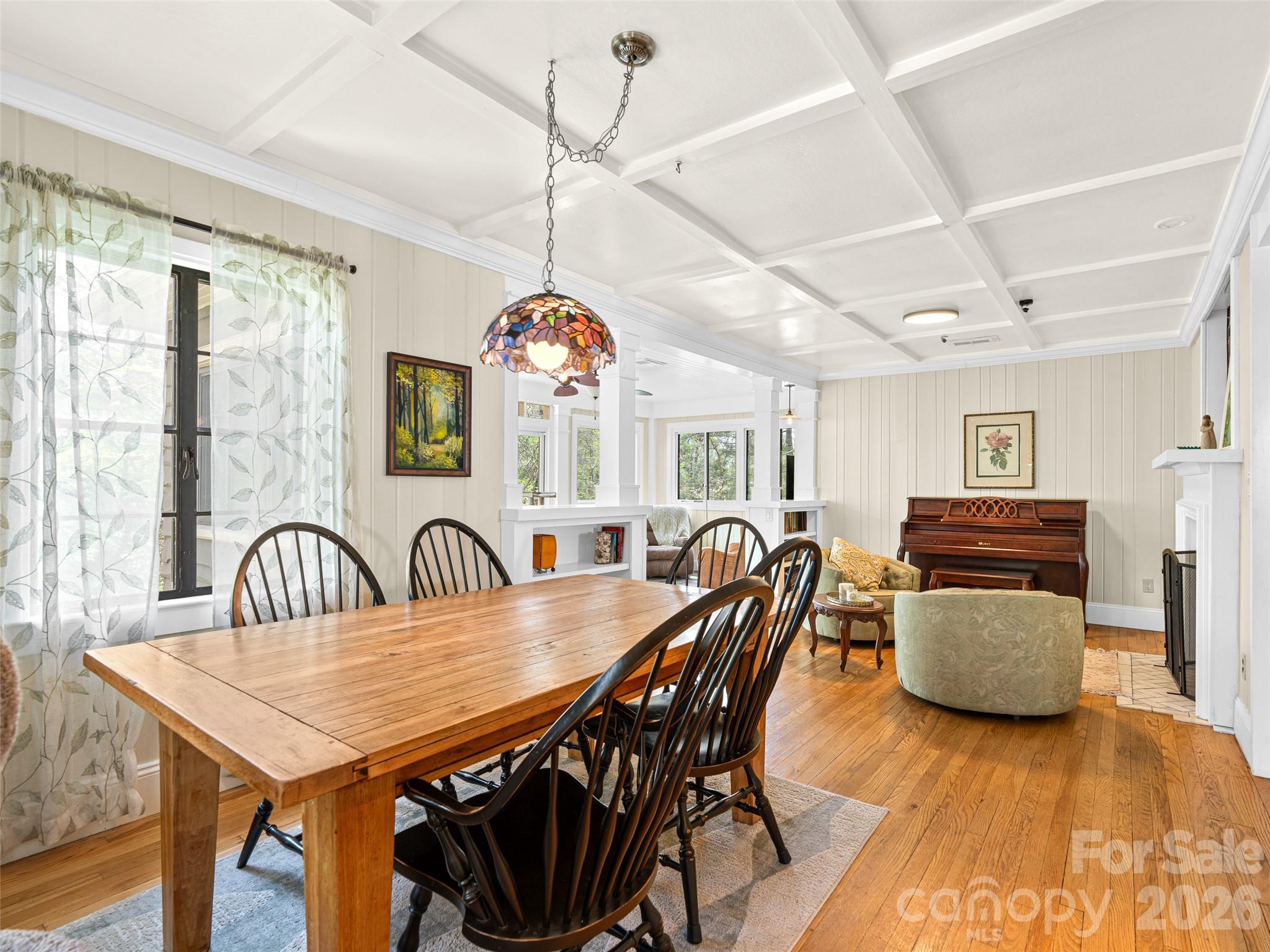 686 New Haw Creek Road Asheville, NC 28805 - Photo 6 of 47 a view of a dining room with furniture window and wooden floor
