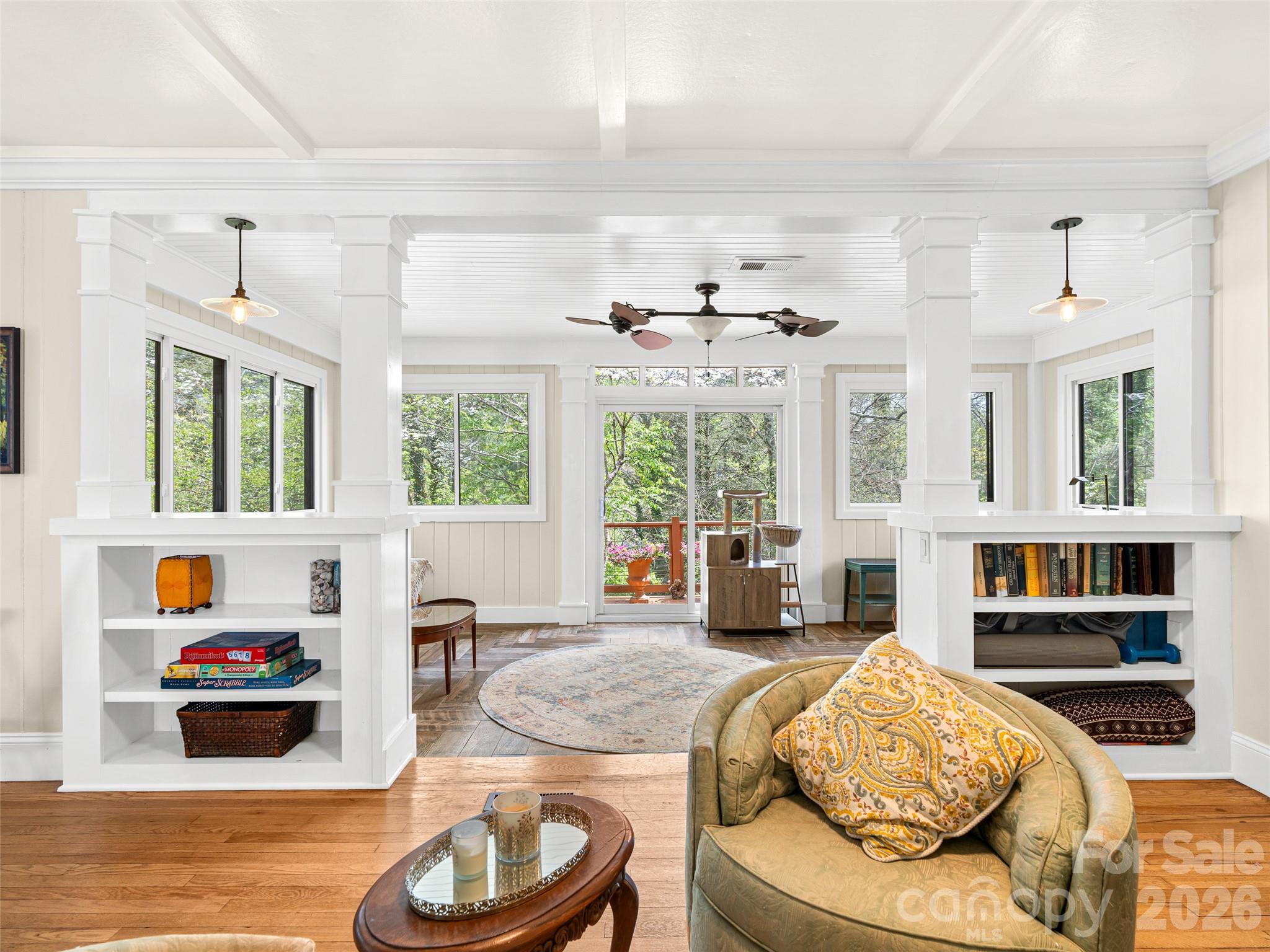 686 New Haw Creek Road Asheville, NC 28805 - Photo 9 of 47 a living room with furniture and a floor to ceiling window