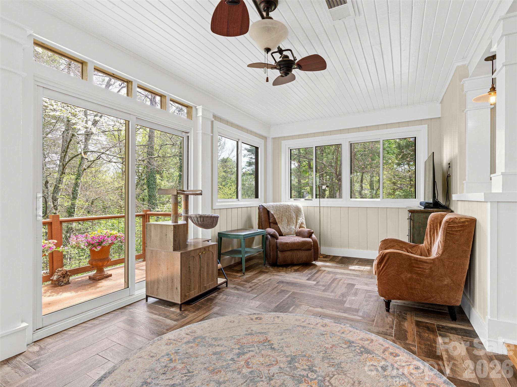 686 New Haw Creek Road Asheville, NC 28805 - Photo 10 of 47 a living room with furniture and floor to ceiling windows
