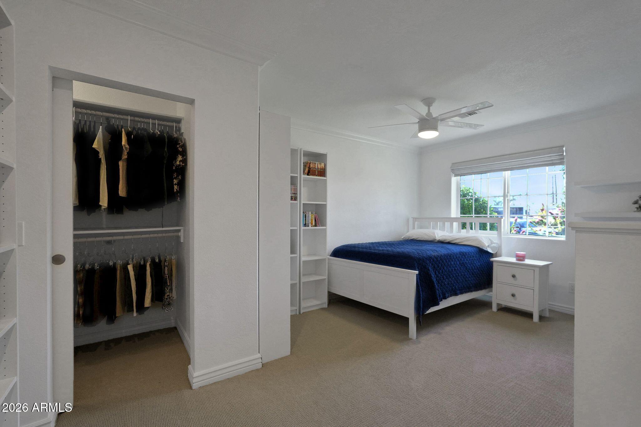5019 North 2nd Street Phoenix, AZ 85012 - Photo 18 of 30 a bedroom with a bed and a window