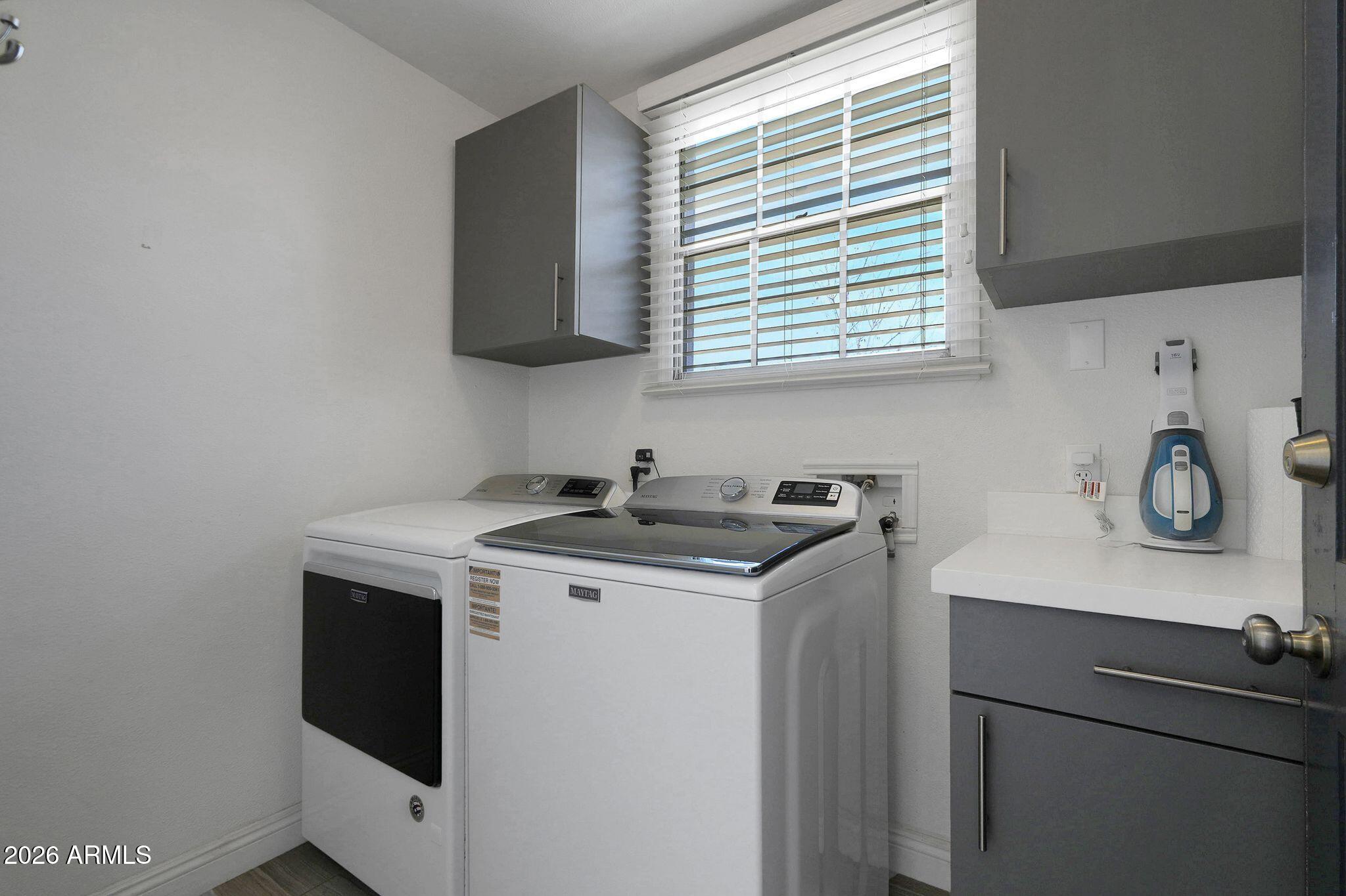5019 North 2nd Street Phoenix, AZ 85012 - Photo 27 of 30 a kitchen with a sink cabinets and a window