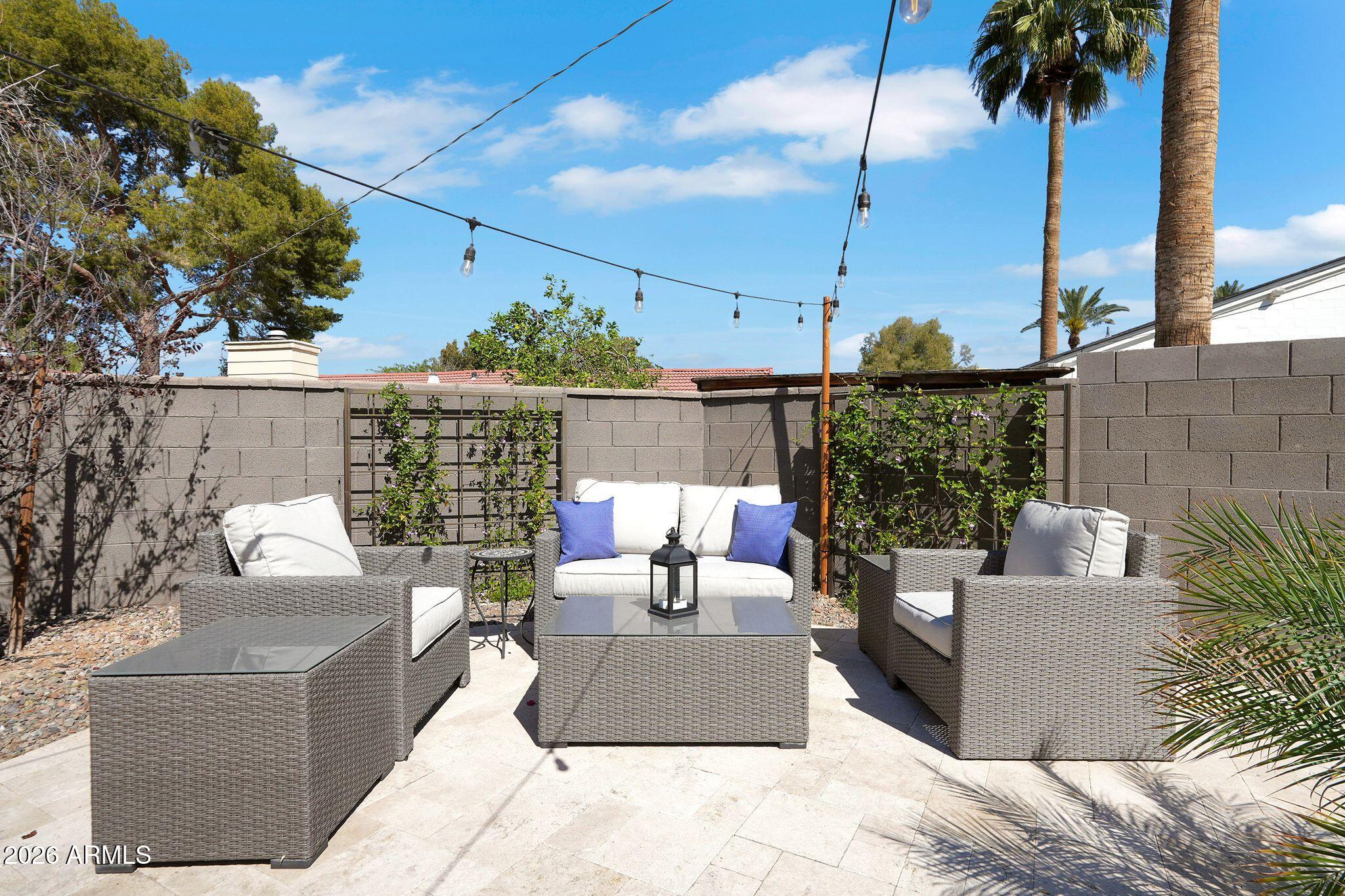 5019 North 2nd Street Phoenix, AZ 85012 - Photo 8 of 30 a outdoor living space with furniture potted plant and a large window