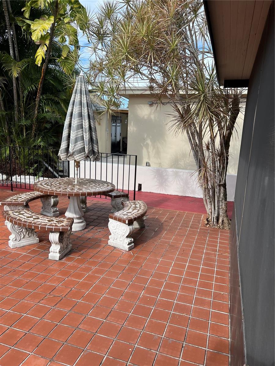 6385 Southwest 25th Street Miami, FL 33155 - Photo 26 of 28 a bench sitting in the middle of a house