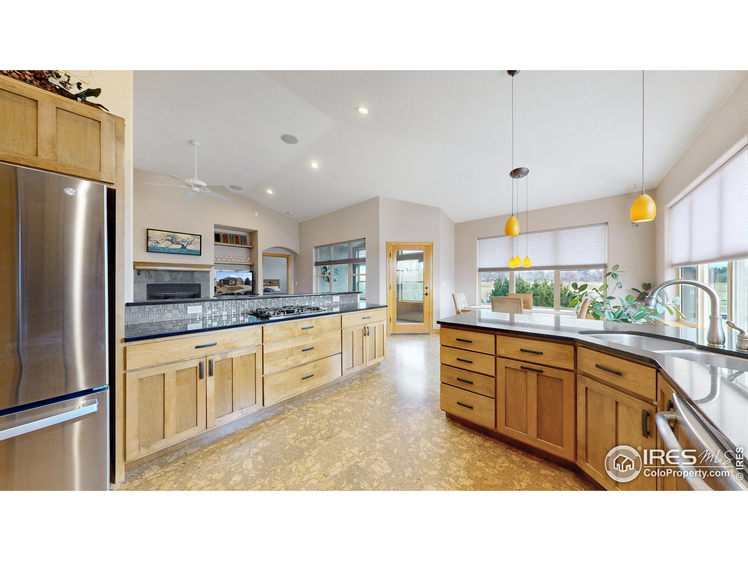 3602 Doral Place Longmont, CO 80503 - Photo 12 of 40 a kitchen with stainless steel appliances granite countertop a sink and cabinets