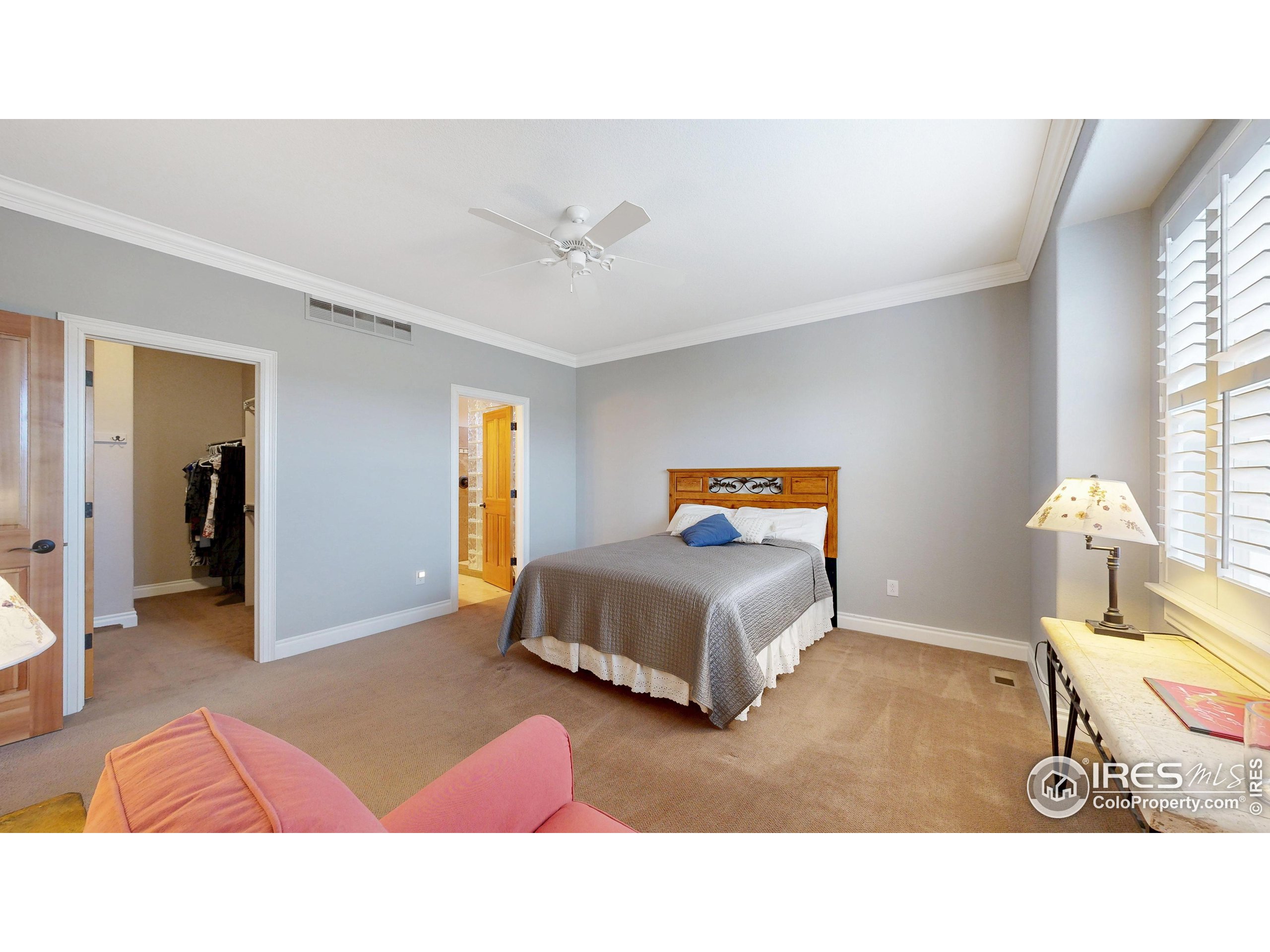 3602 Doral Place Longmont, CO 80503 - Photo 15 of 40 a living room with a bed furniture and a window