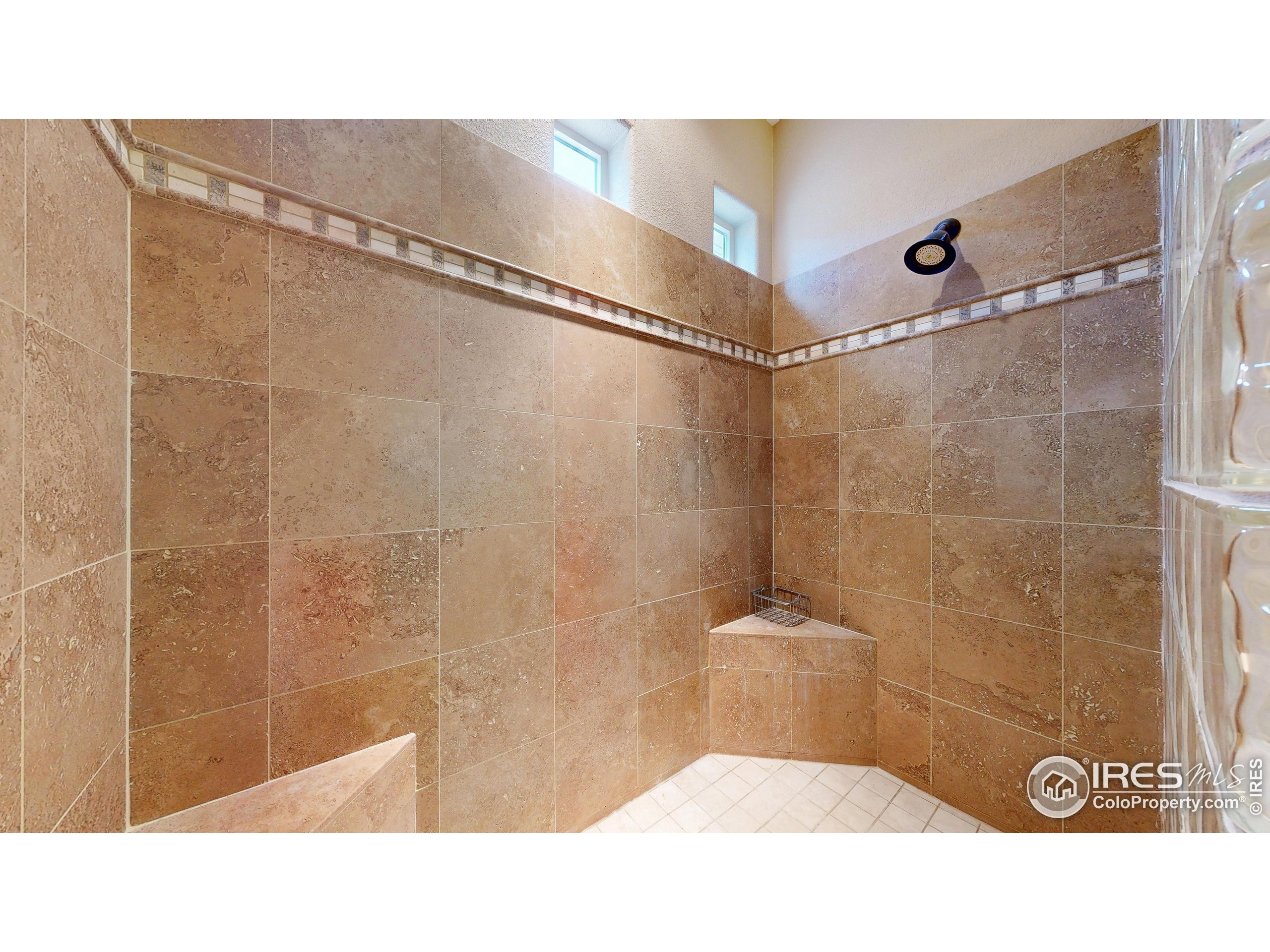 3602 Doral Place Longmont, CO 80503 - Photo 17 of 40 a bathroom with a shower and a sink