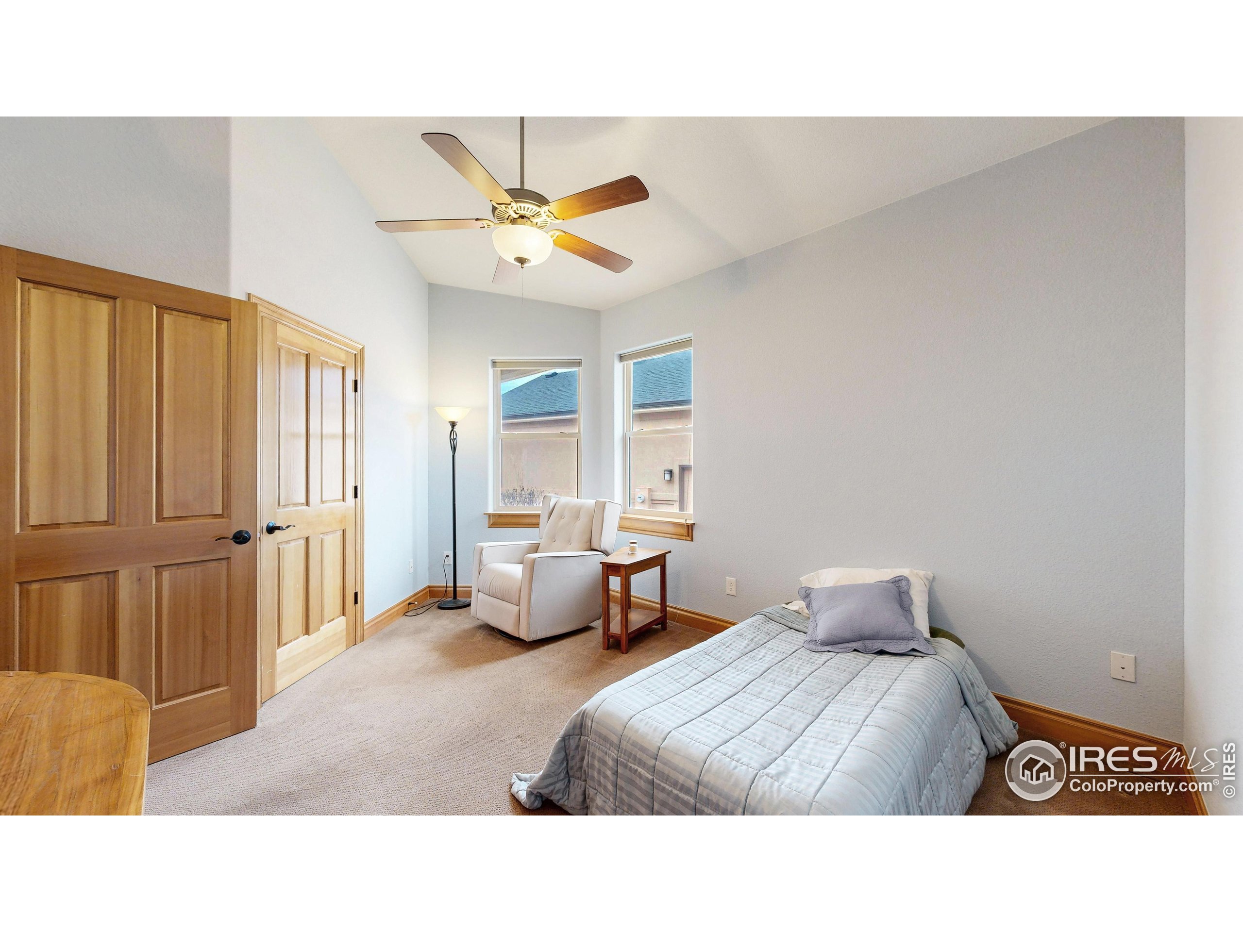 3602 Doral Place Longmont, CO 80503 - Photo 18 of 40 a living room with a bed and furniture