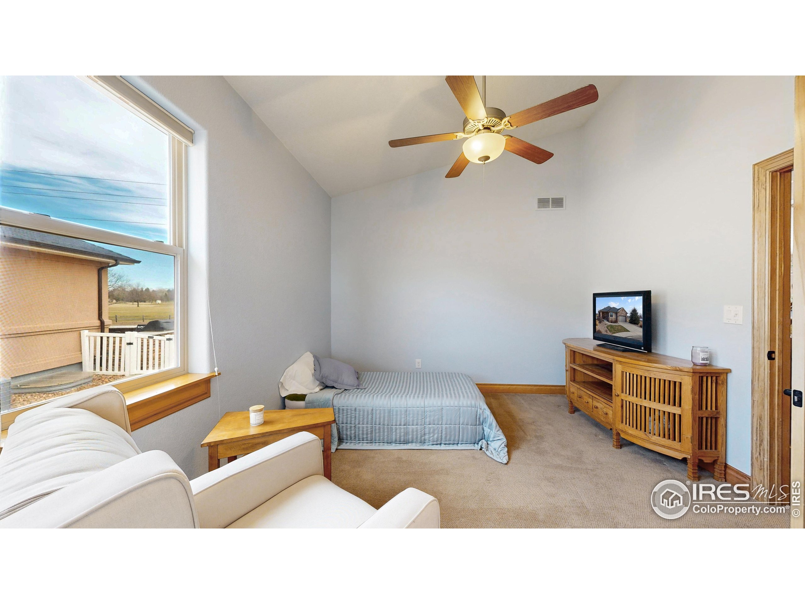 3602 Doral Place Longmont, CO 80503 - Photo 19 of 40 a living room with furniture and a ceiling fan