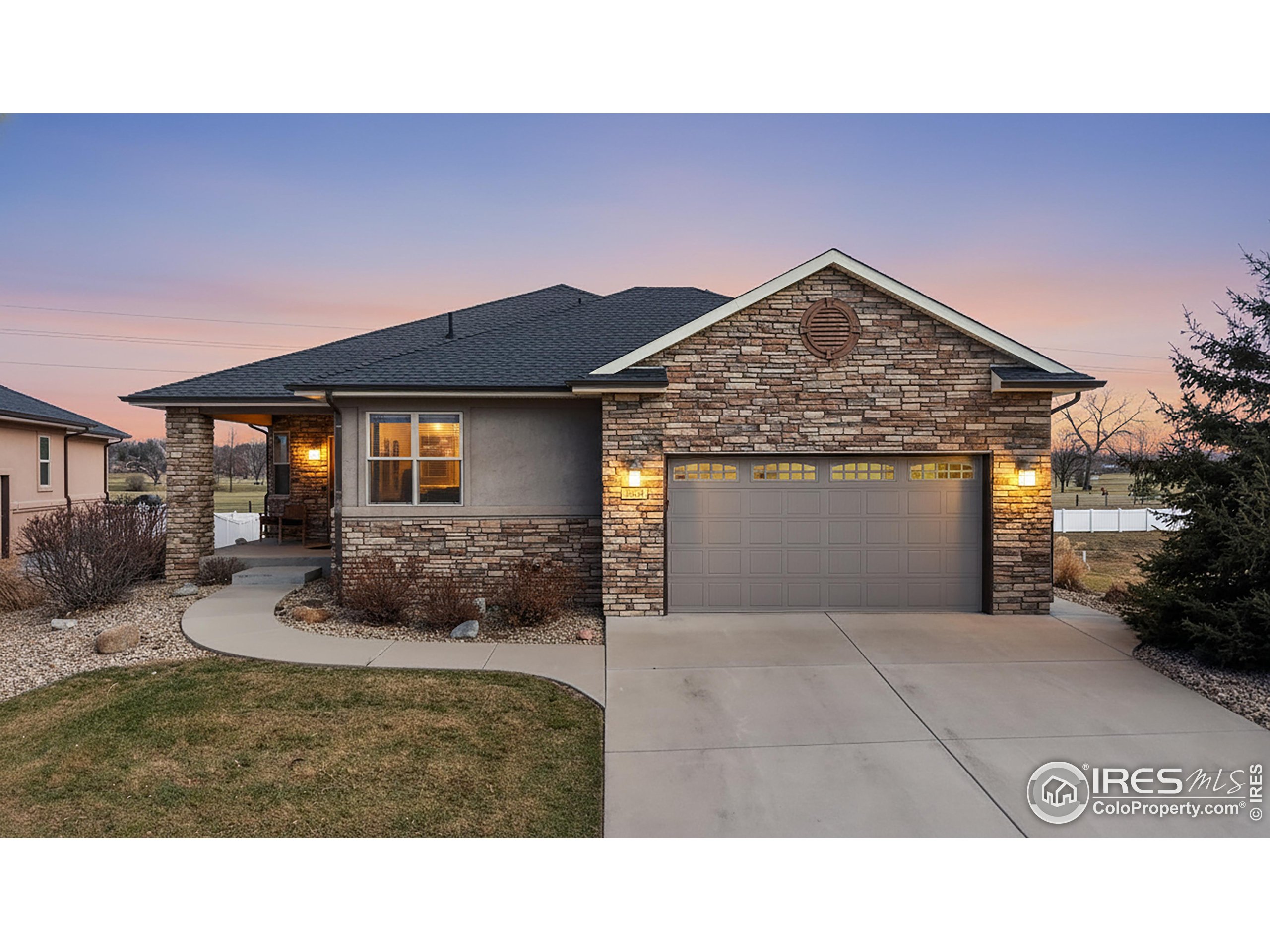 3602 Doral Place Longmont, CO 80503 - Photo 2 of 40 a view of a house with a yard