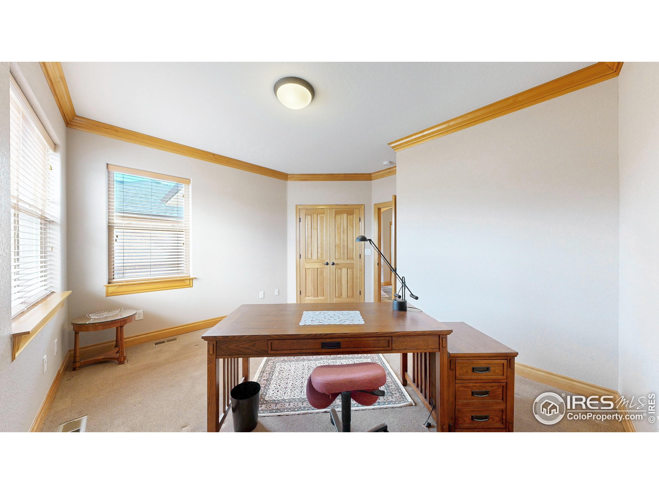 3602 Doral Place Longmont, CO 80503 - Photo 23 of 40 a bedroom with a bed and window