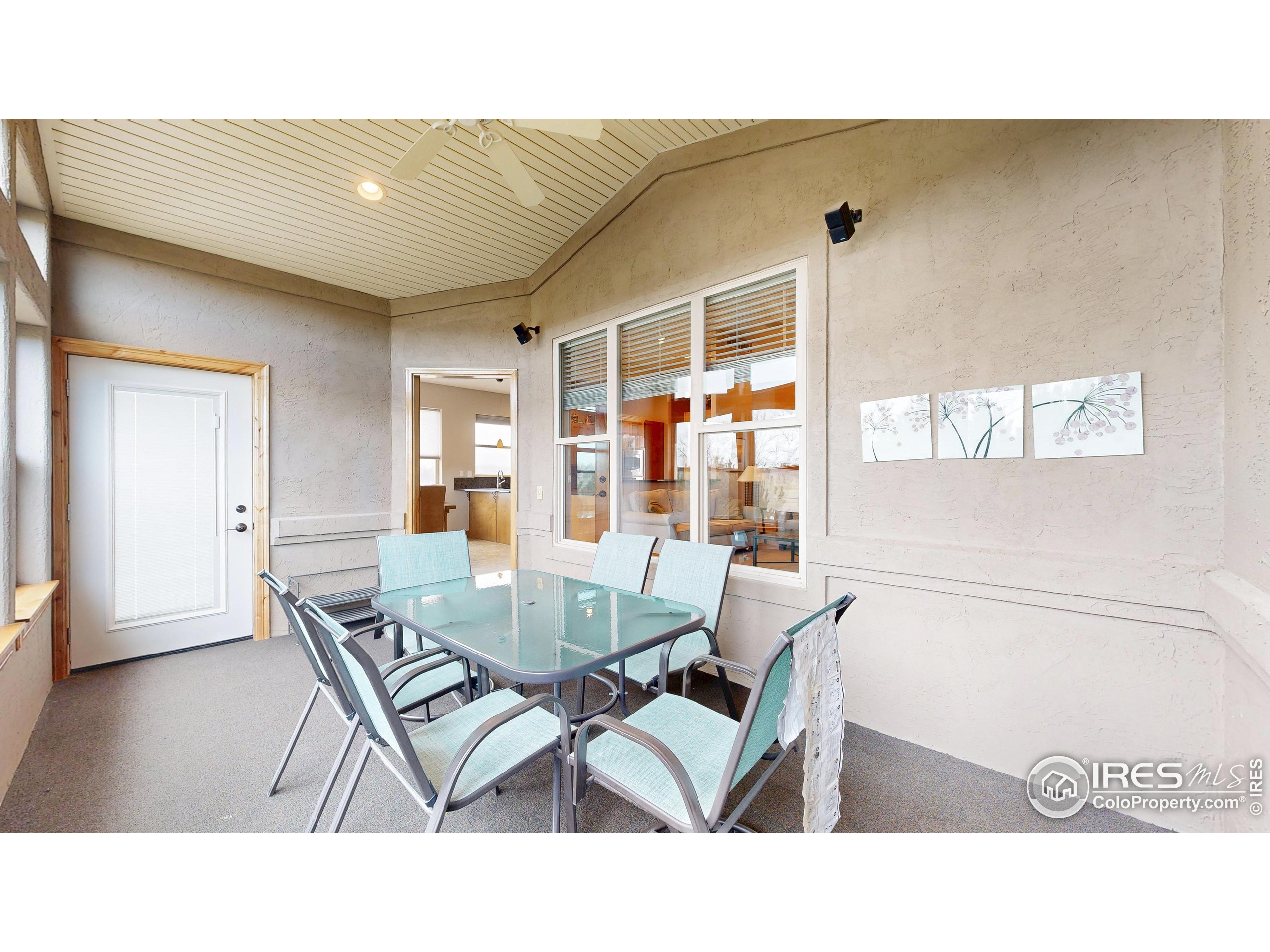 3602 Doral Place Longmont, CO 80503 - Photo 29 of 40 a dining room with furniture and window