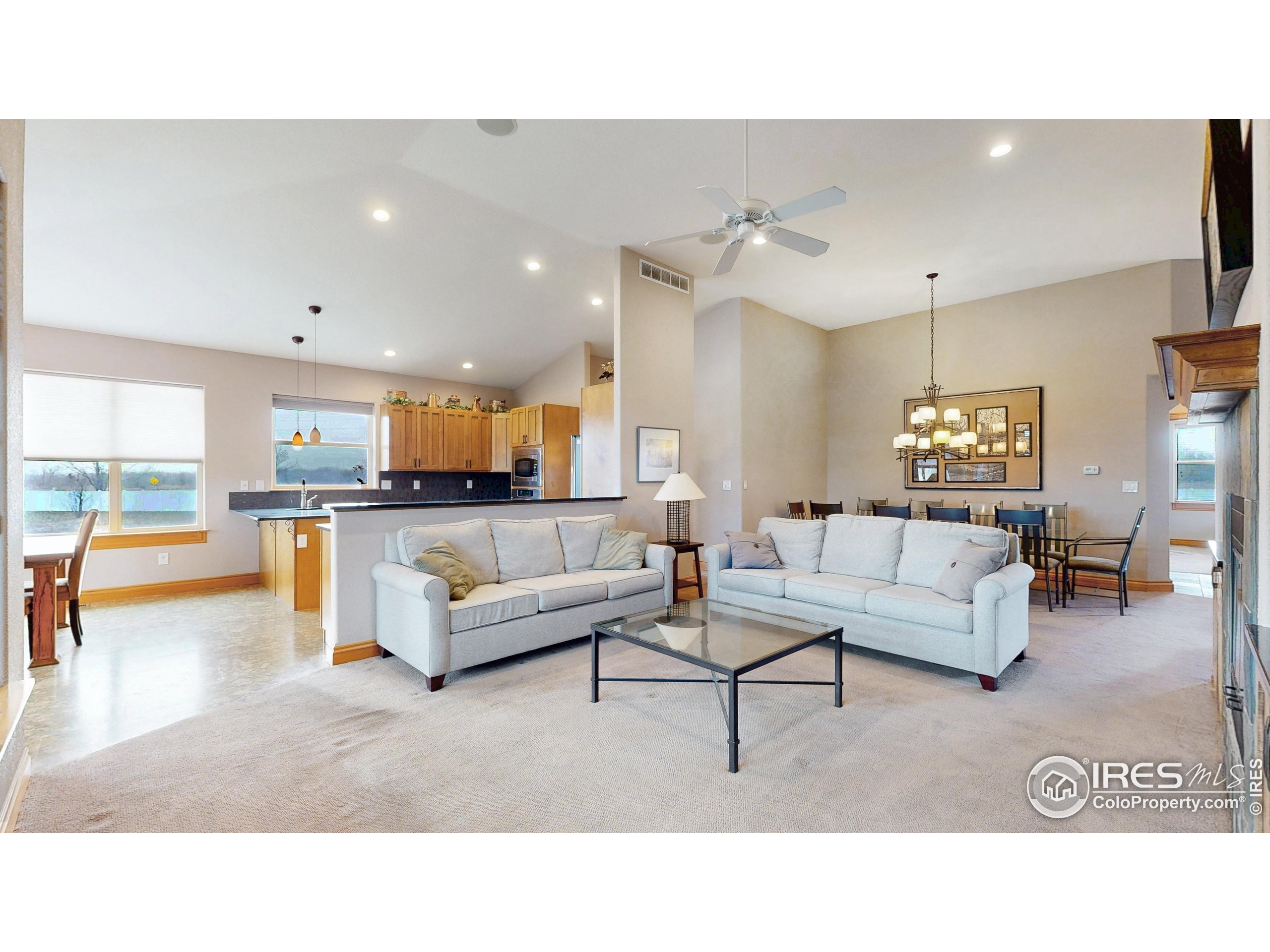 3602 Doral Place Longmont, CO 80503 - Photo 6 of 40 a living room with furniture and view of kitchen