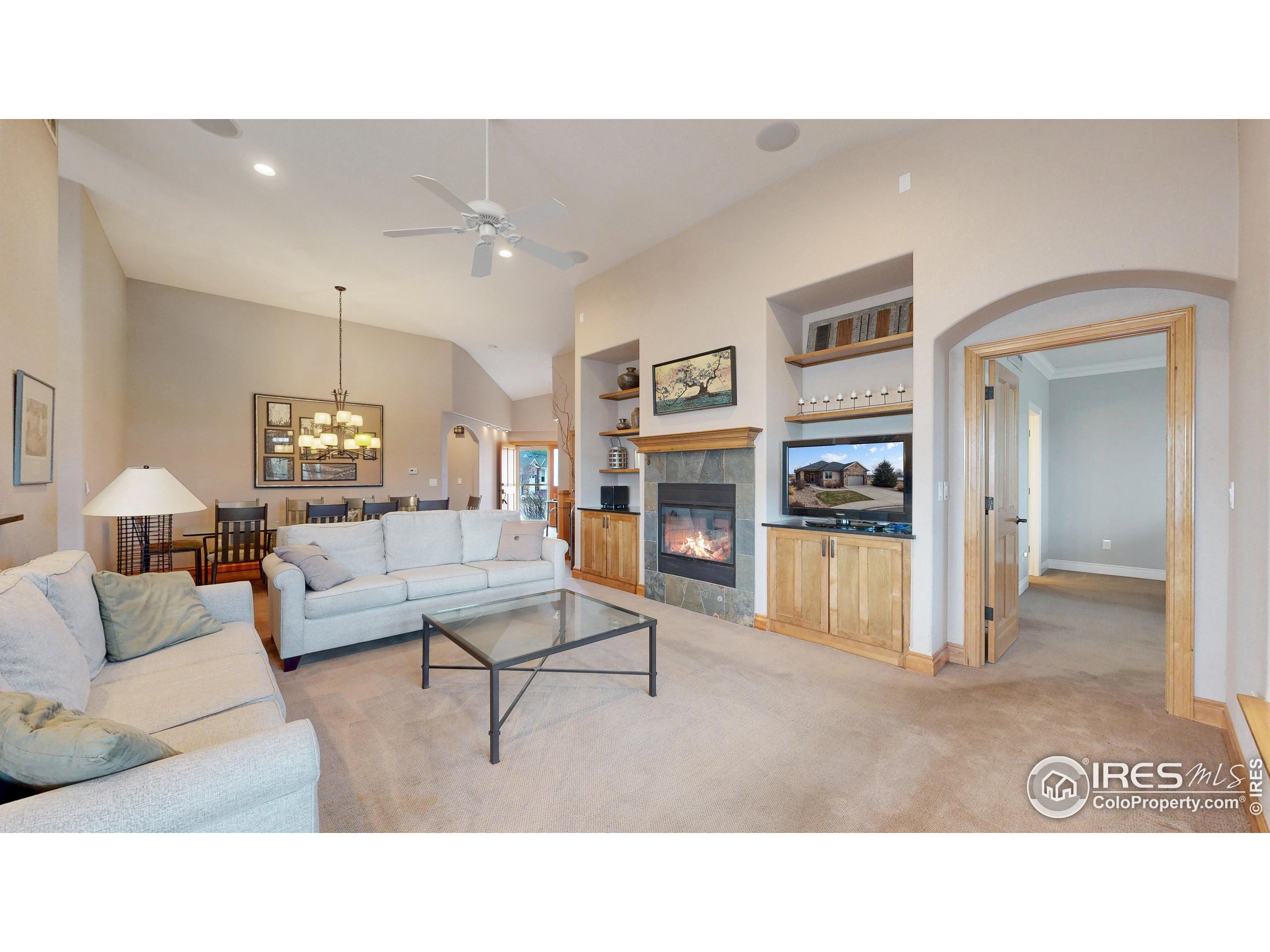 3602 Doral Place Longmont, CO 80503 - Photo 7 of 40 a living room with furniture and a fireplace
