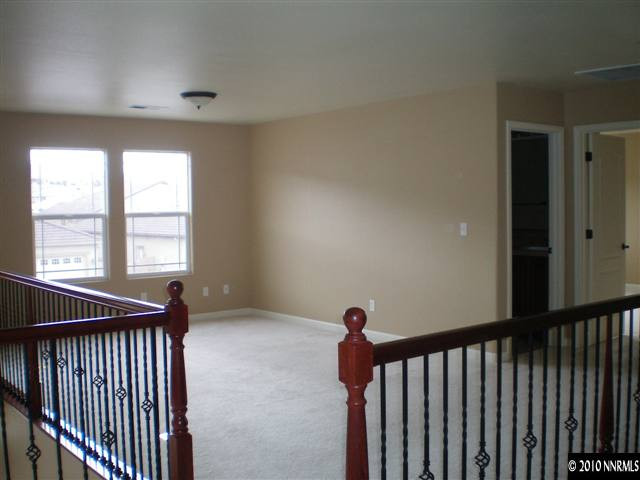 10895 Dancing Aspen Drive Reno, NV 89521 - Photo 3 of 9 a view of a hallway with windows