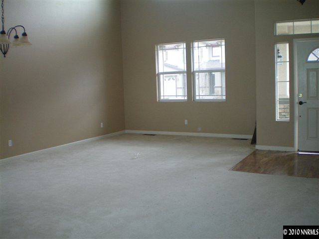 10895 Dancing Aspen Drive Reno, NV 89521 - Photo 4 of 9 an empty room with windows