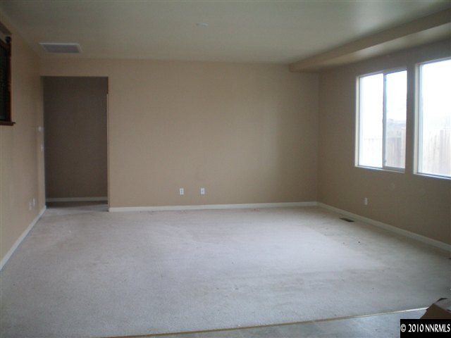 10895 Dancing Aspen Drive Reno, NV 89521 - Photo 6 of 9 an empty room with windows