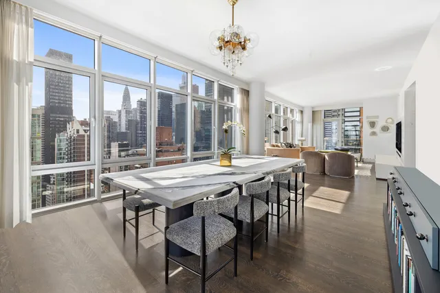 a view of a dining room with furniture window and outside view