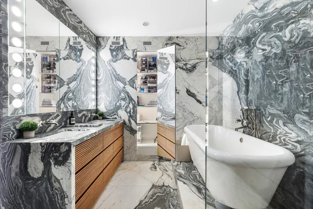 a bathroom with a bathtub and sink