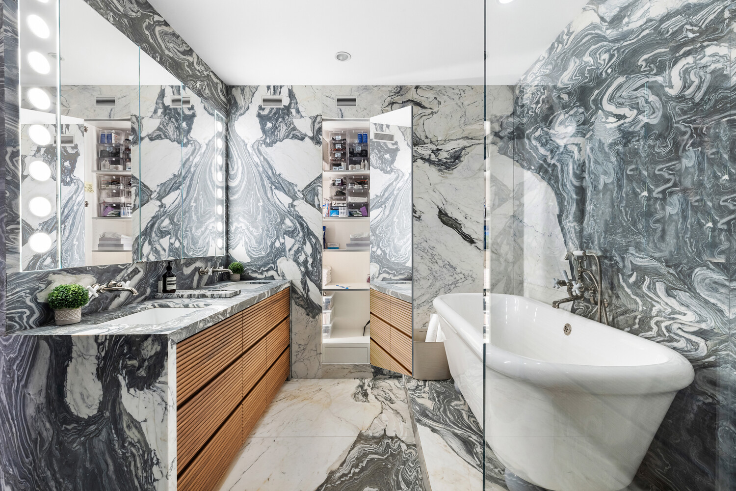 310 East 53rd Street, Unit 21C Manhattan, NY 10022 - Photo 11 of 19 a bathroom with a bathtub and sink