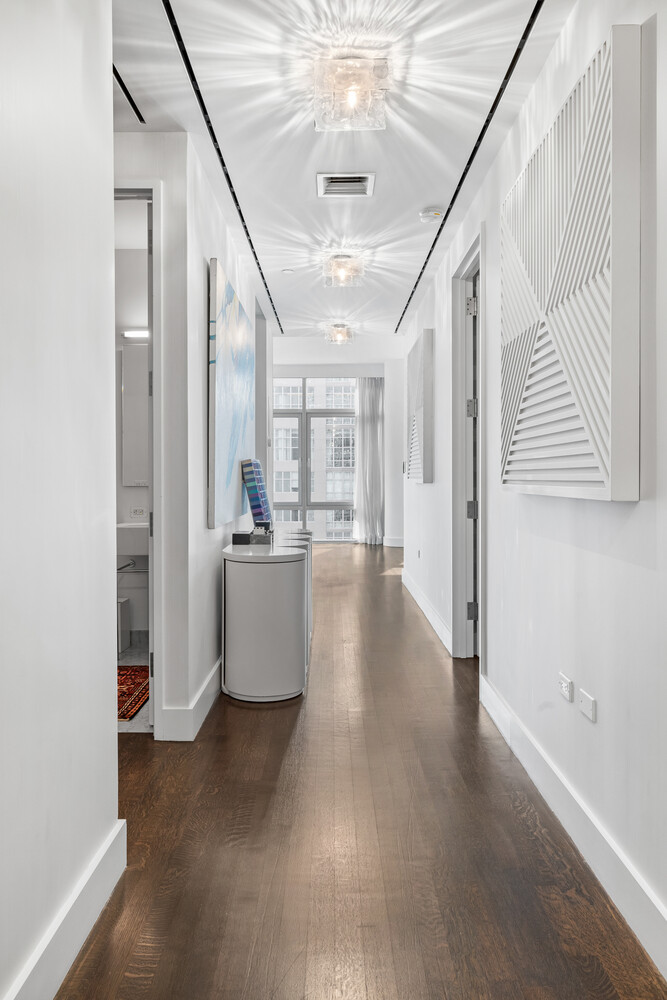 310 East 53rd Street, Unit 21C Manhattan, NY 10022 - Photo 13 of 19 a view of an entryway with kitchen and a window