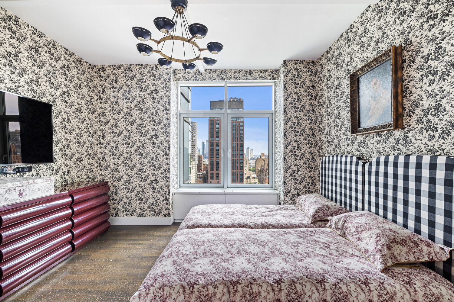 310 East 53rd Street, Unit 21C Manhattan, NY 10022 - Photo 16 of 19 a bedroom with a bed and a flat screen tv