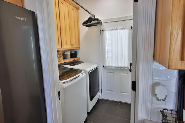 a utility room with window washer and dryer