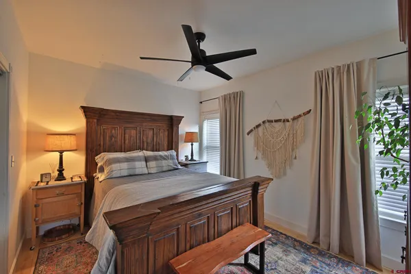 a bedroom with a bed and a dresser